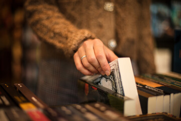 woman in library takes book. 