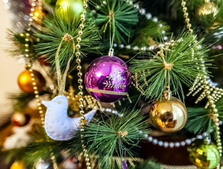 Christmas artificial tree decorated with toys