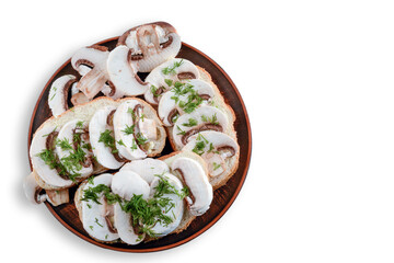 Sandwiches with raw mushrooms champignon and dill on a plate, white isolated background