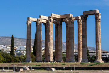 Fototapeta premium The Temple of Olympian Zeus also known as the Olympieion is a former colossal temple at the center of the Greek capital Athens. Sunny summer day with blue sky
