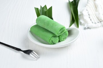 dadar gulung or ketayap is an traditional sweet snack ,popular in indonesia and malaysia .white background