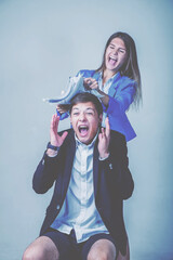 Young female team leader aggressing male employee working in office, she scolding her employee worker for mistake or incompetence. Vertical image.