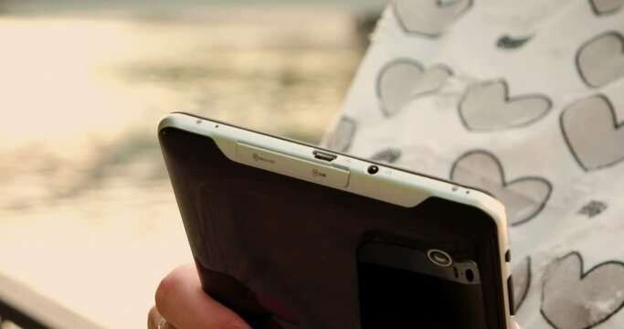 Women with tablet computer or phablet in hands