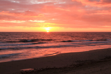 Naklejka na ściany i meble Sunrise on the beach in Arenales del Sol, Alicante