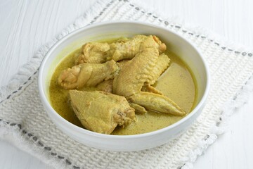 Opor ayam or chicken  curry ,traditional Indonesian food ,is chicken cooked with coconut milk and spices, served to celebrate Eid al_Fitr or Lebaran.