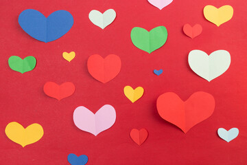 Use scissors to cut into heart-shaped pieces of paper