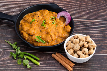 Veg Curry Masala Sabji Soya Chunks Nutri Nugget Made Of Soy Cooked Fresh In Black Pan. The Sabzi Is Rich Source Of Protein And Has Multiple Health Benefits. Wooden Background With Space For Text