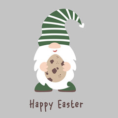 Fototapeta premium Cute Easter gnome holds an egg in his hands. Baby dwarf Easter decor. Isolated on dark background.