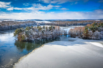 Fototapeta na wymiar Aerial landscape of the frozen lake in Poland at winter