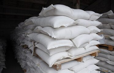 Bags of grain in the factory warehouse are ready for further processing.