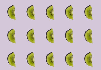 Kiwis isolated on purple background. Half of kiwi. Kiwi pattern.