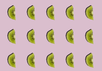 Kiwis isolated on purple background. Half of kiwi. Kiwi pattern.