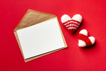Valentines day card mockup with envelope and knitted hearts
