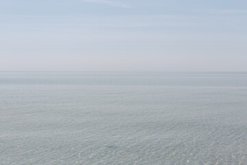 Clear and blue sea with a soft horizon
