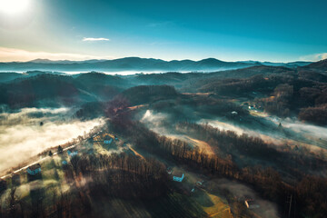 Aerial view of foggy sunrise in Bosnian countryside