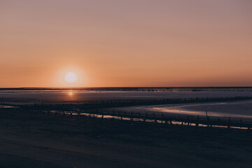 Beautiful sunset over the salty pink lake