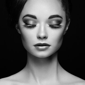 Beautiful woman face. Perfect makeup. Beauty fashion. Eyelashes. Cosmetic Eyeshadow. Black and white photo