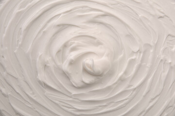 White cosmetic spiral skin cream texture background