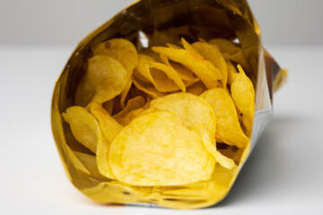 Crispy Potato chips snacks in bag package. Fast food or junk food snacks unhealthy concept.