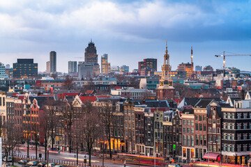 Amsterdam, Netherlands historic cityscape with the modern Zuidas district in the distance - obrazy, fototapety, plakaty