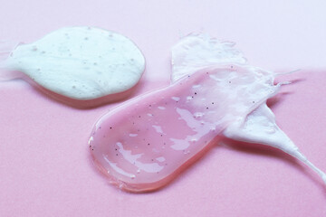 liquid body care products on pink background