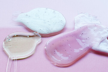 liquid body care products on pink background