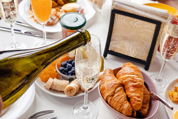 Pouring champagne to the glass close-up. © Diana Vyshniakova