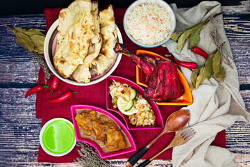Traditional Indian food chicken tandoori and Tikka with garlic naan