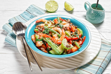 Salad of lentils, shrimps, wilted kale on a plate