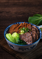 Taiwanese famous food beef noodle on wooden table.