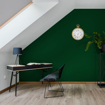 Attic home office room with green wall