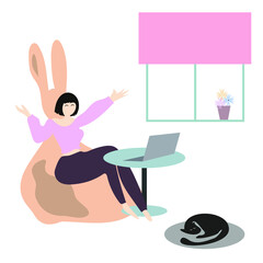 Happy girl sitting barefoot in rabbit puff in front of her laptop at home. Hands up. She is working remotely, talking to someone or shopping online. Cute black cat sleeps nearby. Cozy, minimal, flat.