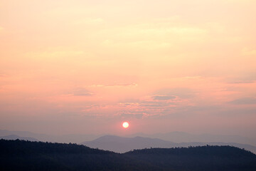 The sun rises in the morning on the mountain of the new day.