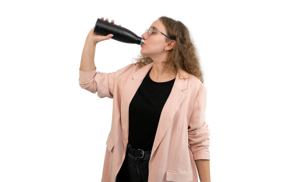 A Woman In A Suit Is Drinking From A Reusable Water Bottle. White Background.