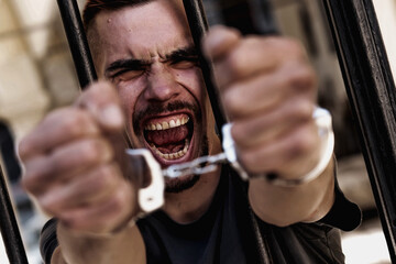 Portrait of upset handcuffed man imprisoned for crime, punished for serious villainy. Arrest,...