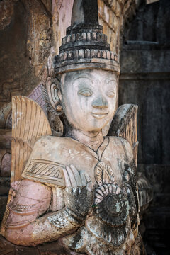 Detail of a nat statue (angel of spirit) in Tharkhaung buddhist monastery in Burma, Myanmar