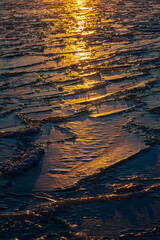 Ice on the river at sunset