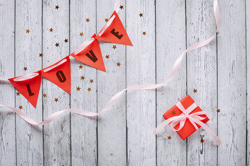 Flat lay romantic photography with paper origami heart on natural background. Cute romantic greeting card template.