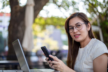 Fototapeta premium Asian woman using computer laptop work from home concept.