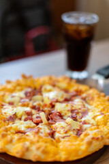 Seafood Italian Pizza slice on wood dish