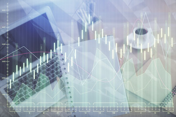 Double exposure of businesswoman hands typing on computer and forex chart hologram drawing. Financial analysis concept.