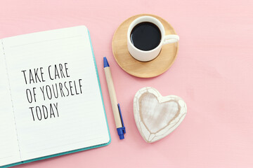 self care concept. notebook with text over pink background
