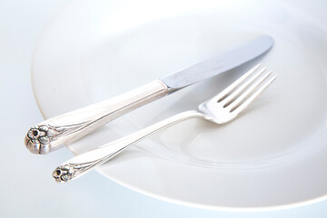 Silverware on a white plate