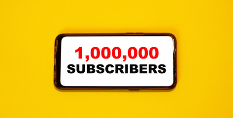 1,000,000 SUBSCRIBERS on a smartphone with orange background