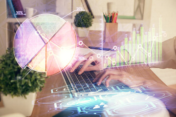 Double exposure of woman hands typing on computer and forex chart hologram drawing. Stock market invest concept.