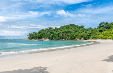 Fototapeta na wymiar Manuel Antonio beatiful tropical beach with white sand and blue ocean. Paradise. National Park in Costa Rica, Central America.