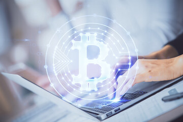 Double exposure of woman hands typing on computer and crypto market theme hologram drawing. Blockchain concept.
