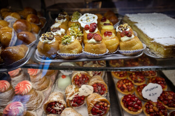 Neapolitan sweet delicacies baba with cream and assorted pastries