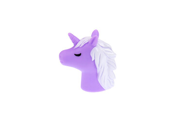A purple unicorn toy head. Isolated on a white background
