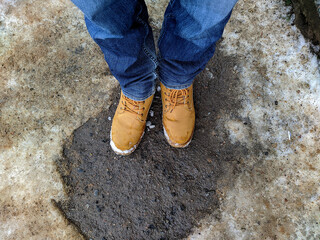 first person view man tilts his head looking for boots